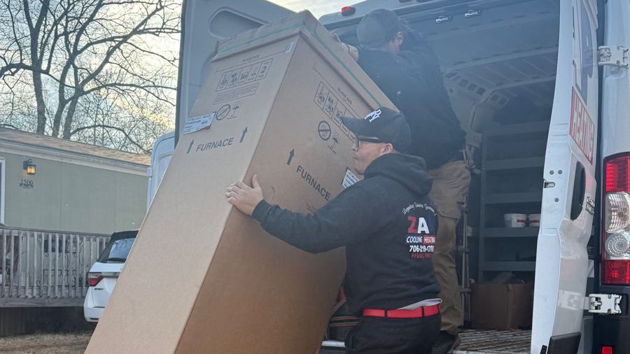 ZAP HVAC techs unloading new furnace.