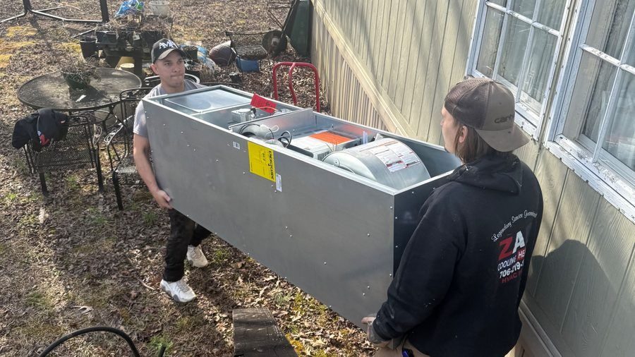 ZAP techs moving heater into the house.
